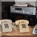 E09. Rotel receiver, Onkyo amplifier and vintage telephones. 